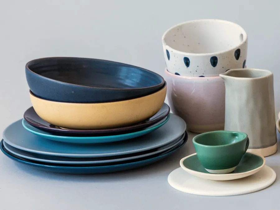 Bowls and plates of glazed ceramic in different colours